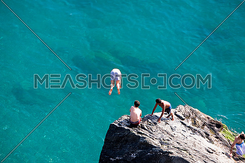 Refreshing images of boys enjoying the sea, Almuñecar, Granada province, Spain